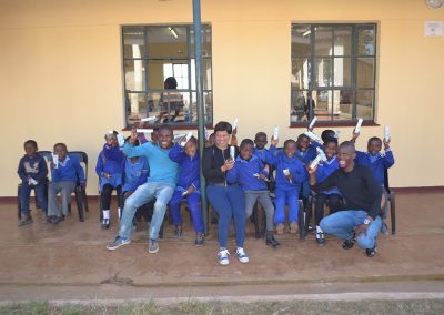 Students with toothpaste & toothbrushes