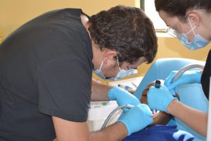 Fillings - assistant holding flash light for visibility