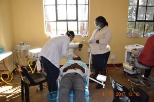Dental team at work -- tooth extraction