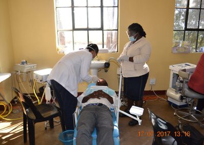 Dental team at work -- tooth extraction